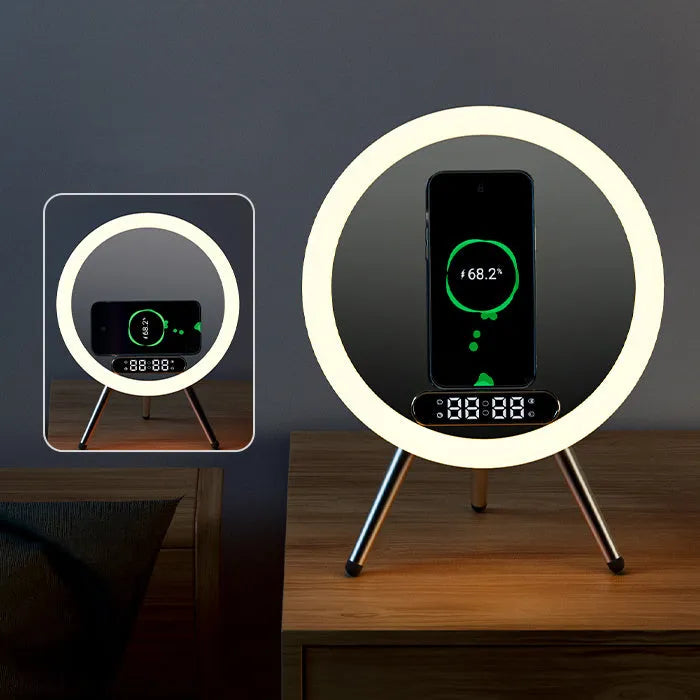White multi-function LED mirror alarm clock with wireless charger and Bluetooth speaker on a table