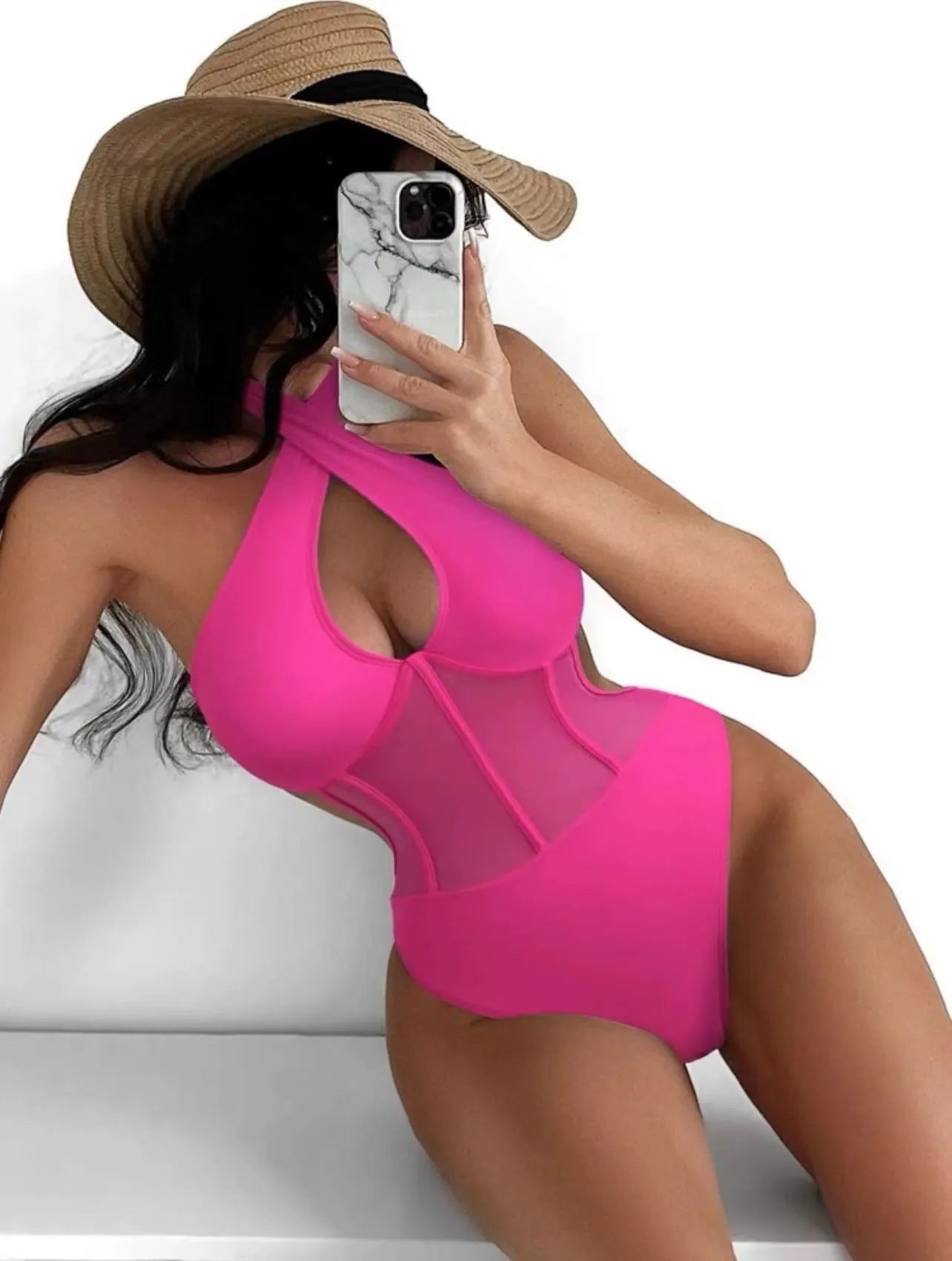 Women's black one-piece nylon swimsuit laid flat, showing its style and material.