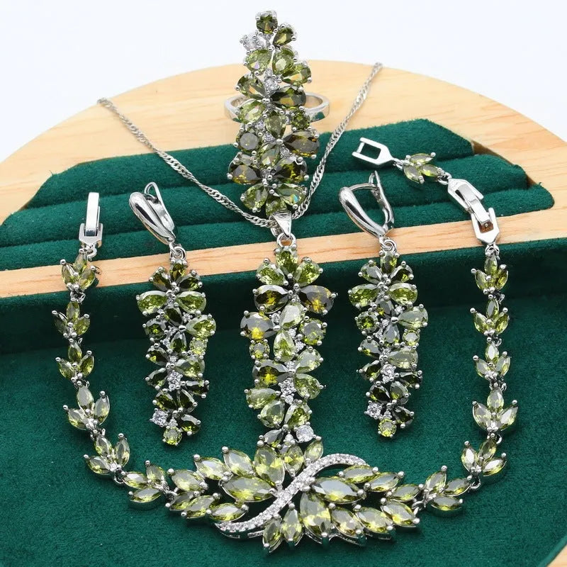 Retro style necklace, earrings, ring, and bracelet set with plants and flowers pattern in olive, purple, and colourful finishes.