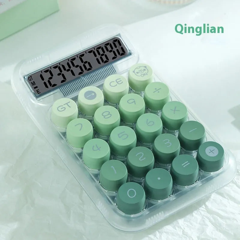 Keyboard-style gradient colour calculator in mute blue, green, pink, or purple on a desk.