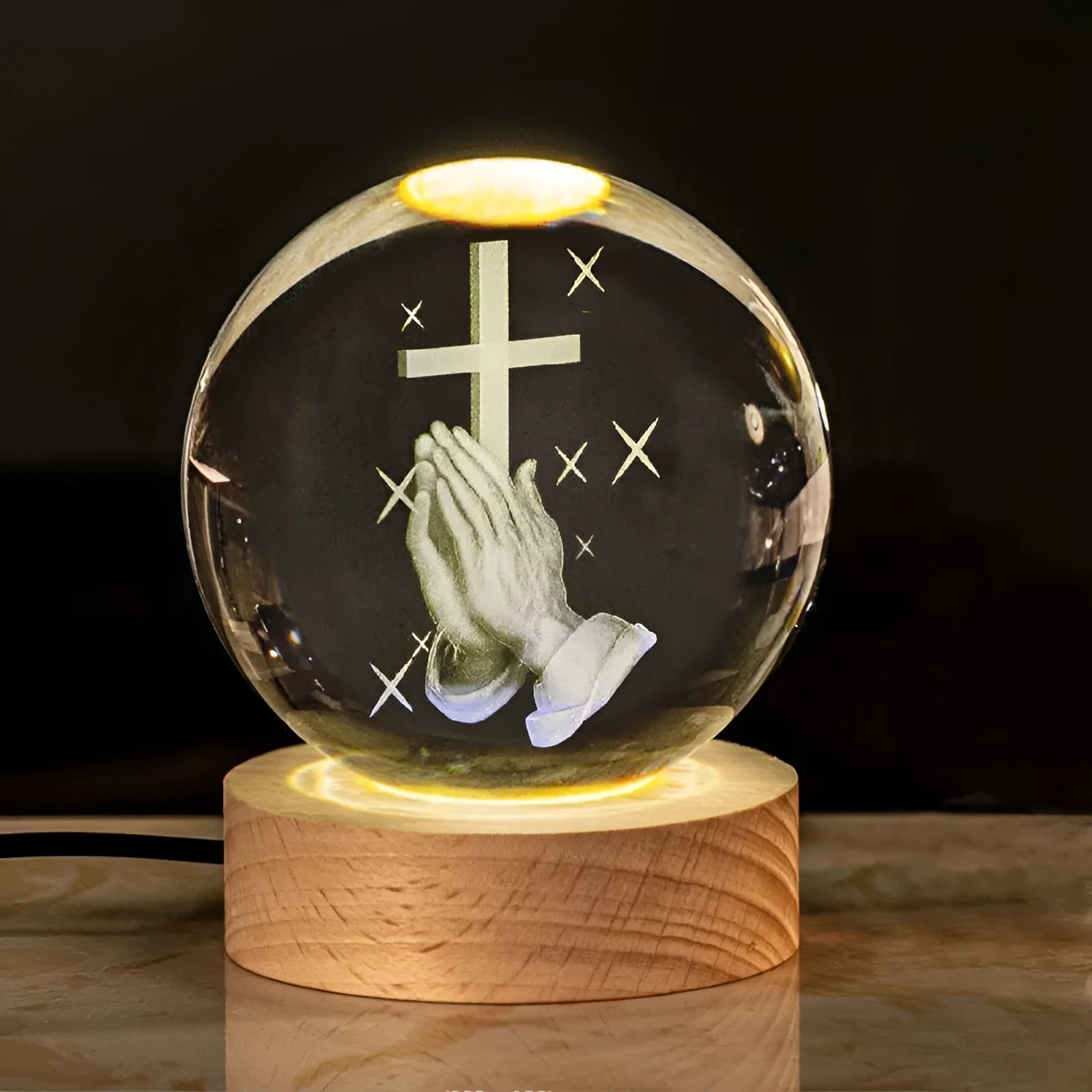 White crystal ball desk ornament on a wooden warm light base, showing purity-themed designs.