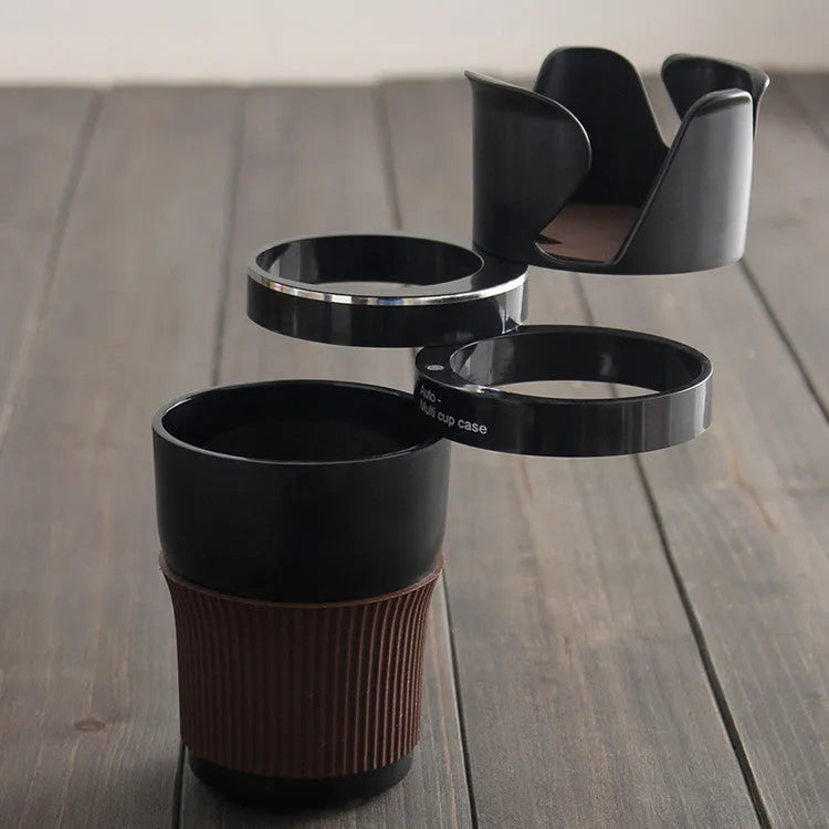 Black multifunction car cup holder with attached navigation phone mount bracket.