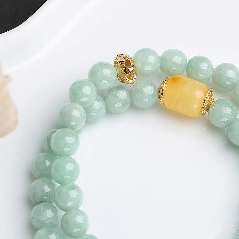 Double-layer jade and beeswax bracelet with hanging barrel beads and retro geometry design
