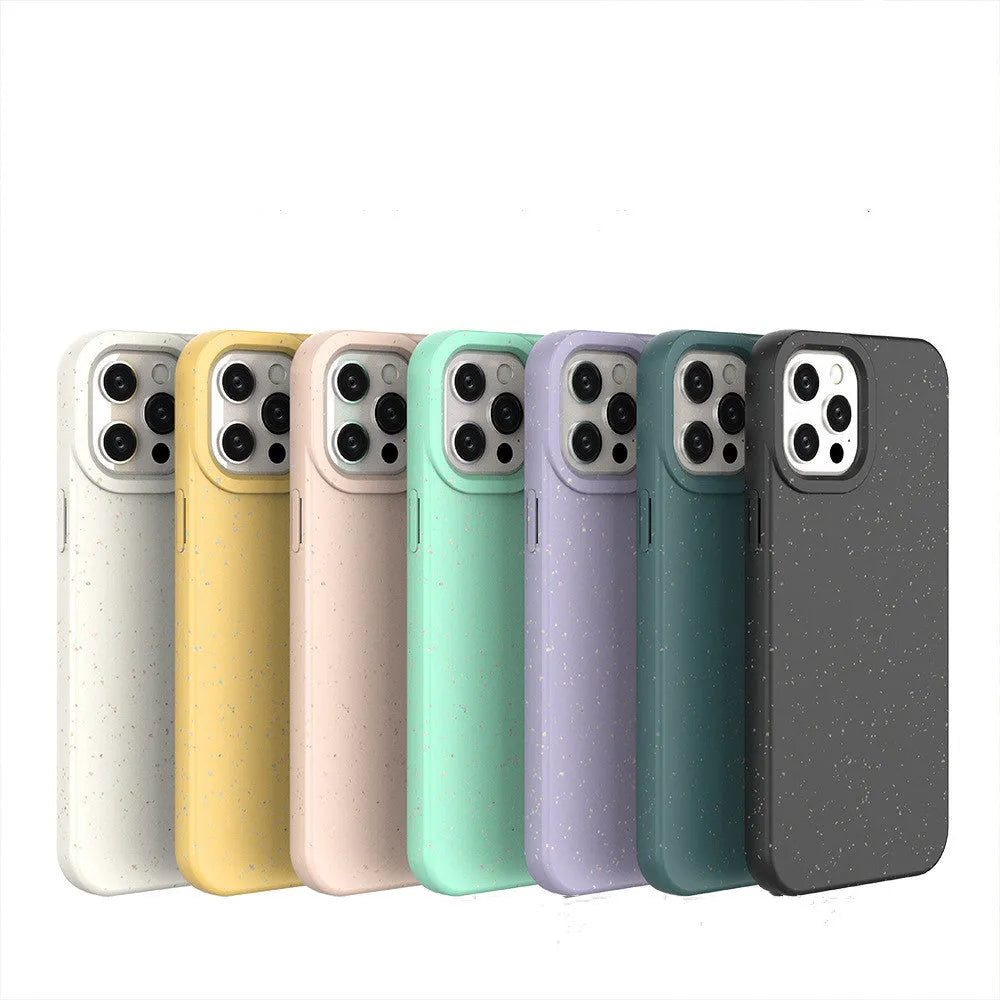 Biodegradable wheat straw mobile phone case for iPhone in seven colour options on a table.