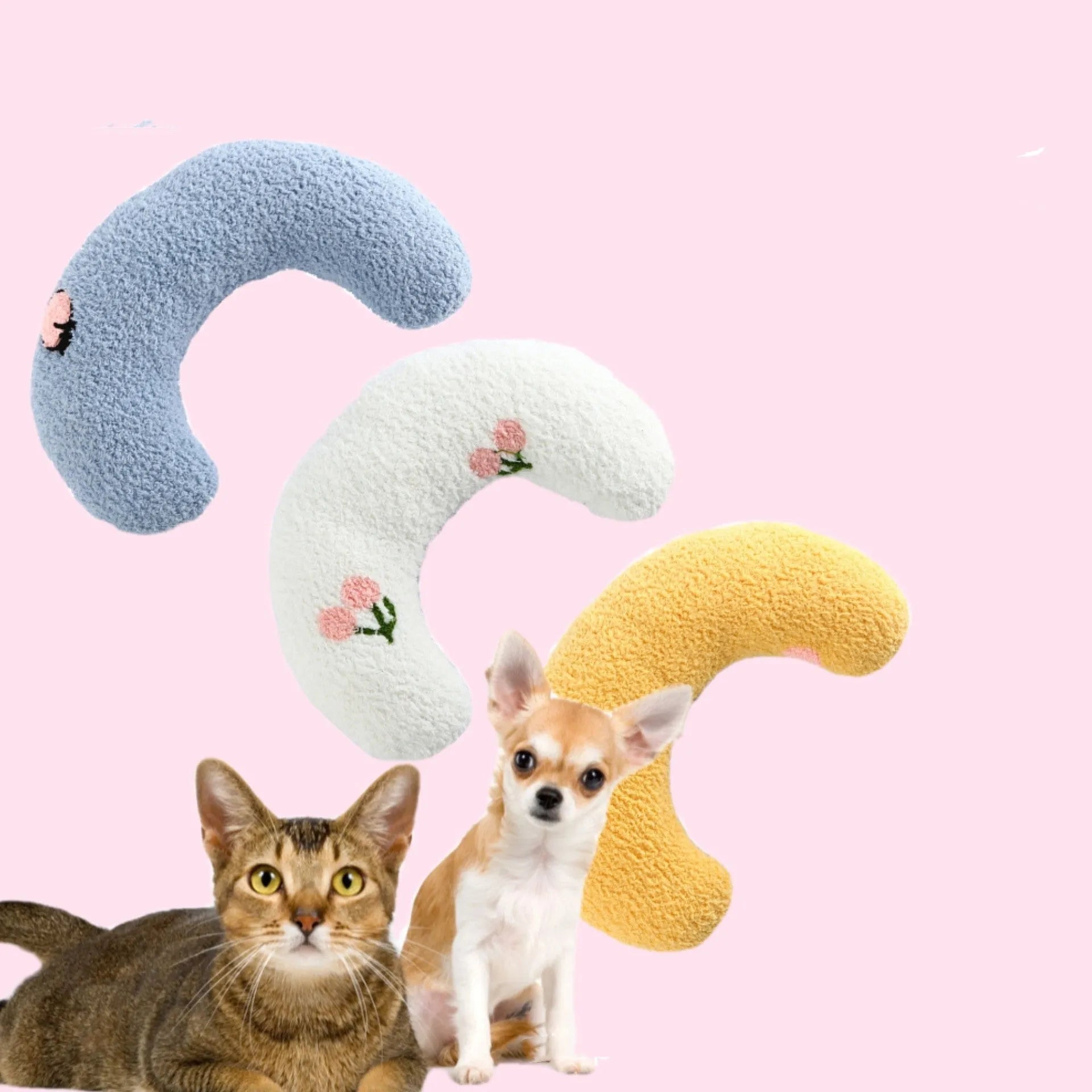 Small white U-shaped plush pillow for a cat or small dog, showing its half-donut shape with a raised rim.