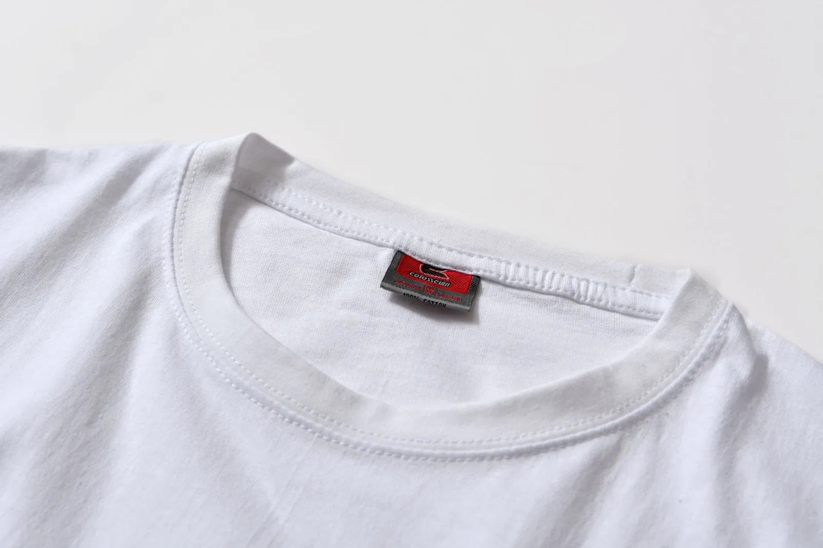 White cotton t-shirt overalls with round neck and short sleeves in loose fit