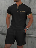 Man wearing a grey waffle-texture zip-up polo top and matching shorts, a summer two-piece suit set.