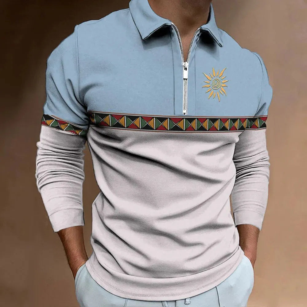 Man wearing a loose-fit, long-sleeve t-shirt with retro colour stripes and zipper decorations.