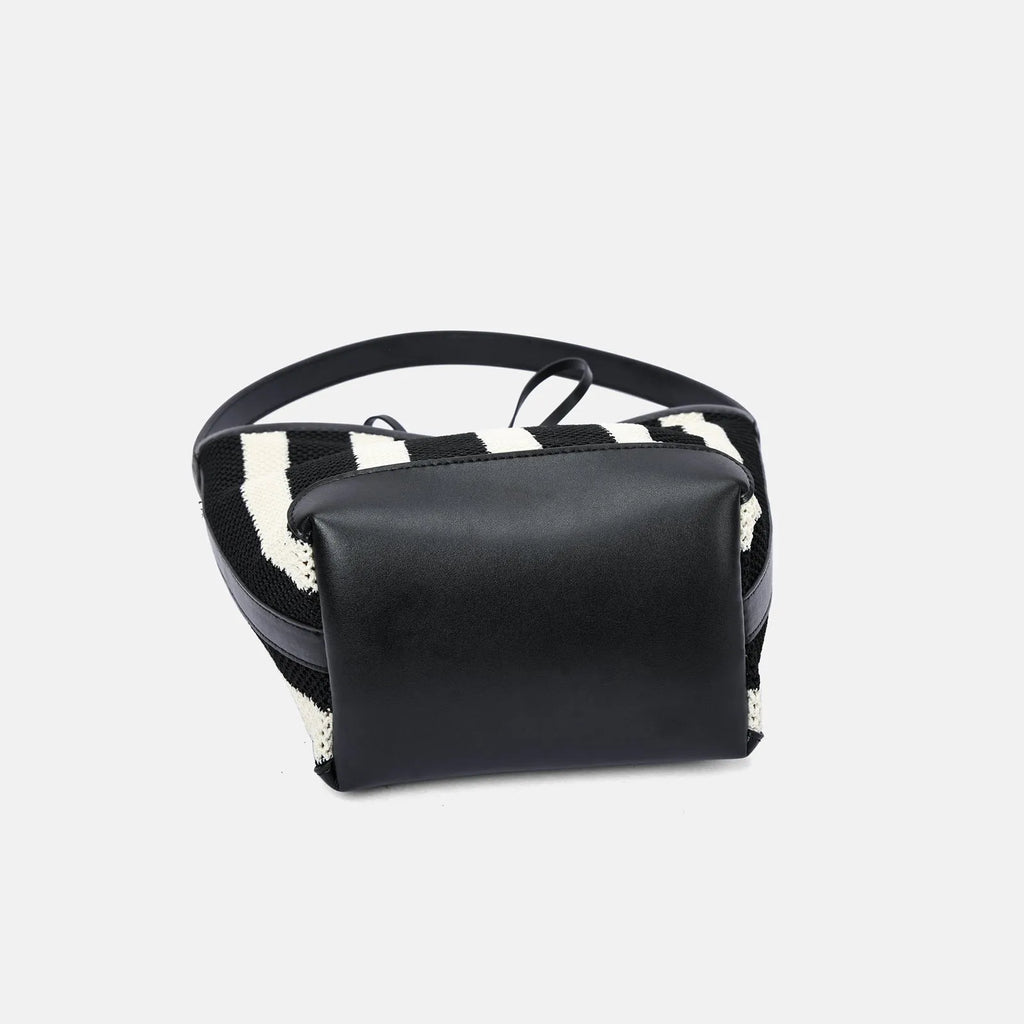 Black and white striped woven fabric women's bucket shoulder bag showing dimensions