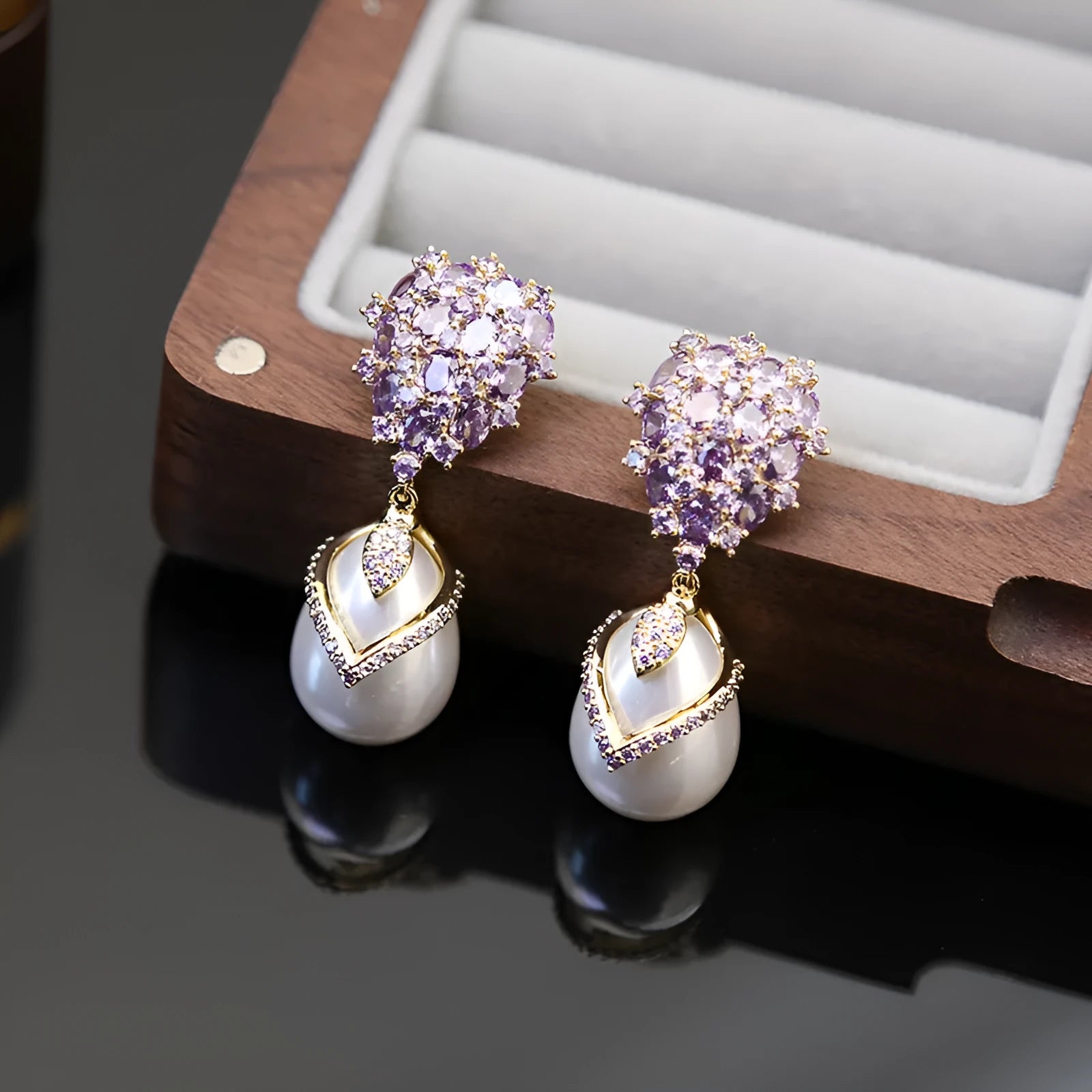 Women's drop shape pearl earrings with zircon accents on 18K gold plated copper setting