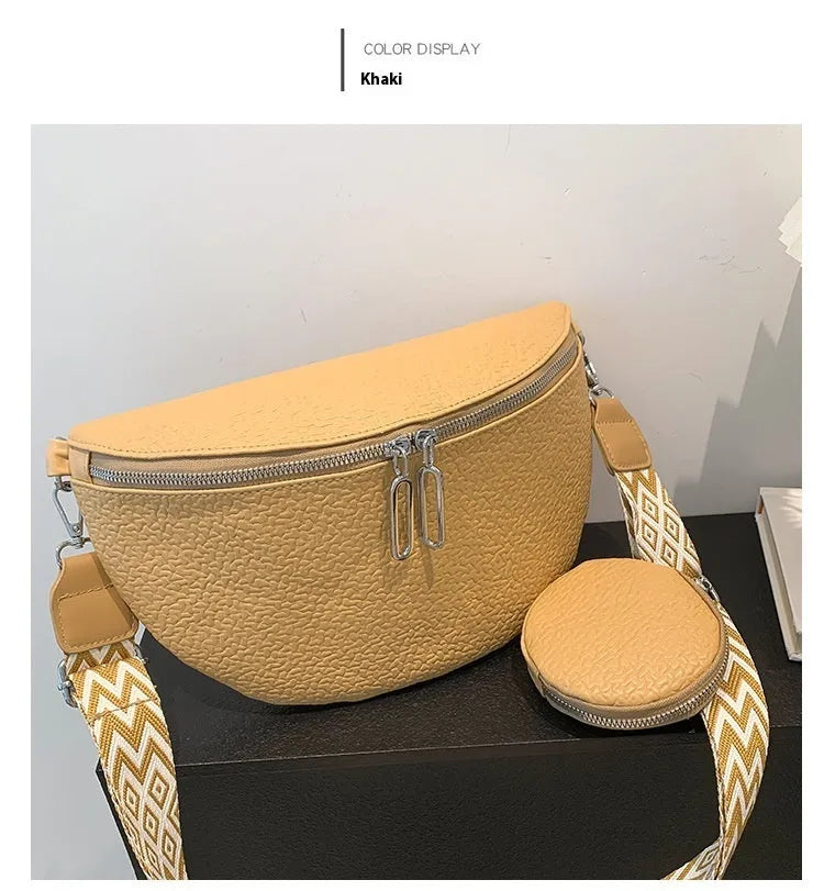 Solid colour women's crossbody bag with textured saddle lock zipper detail in a horizontal square shape