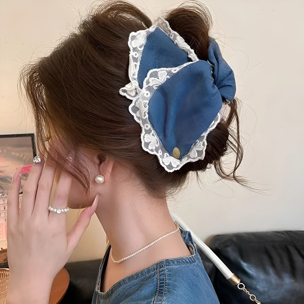 Handmade plastic hairpin with triangle grip shape and bow decoration