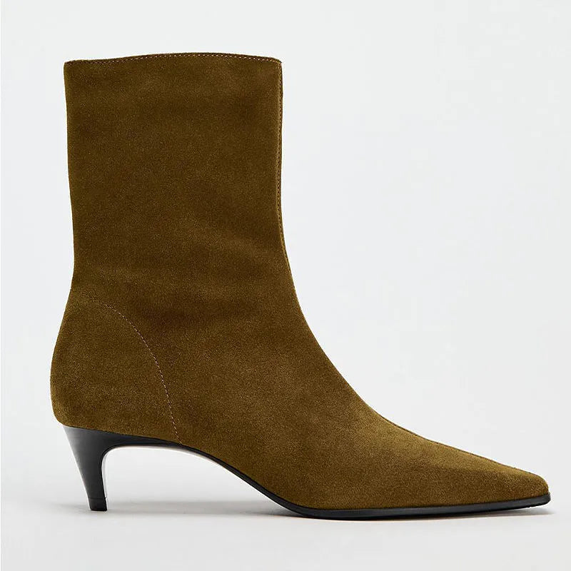 Brown square toe ankle boots with a side zip and a waterproof platform kitten heel.