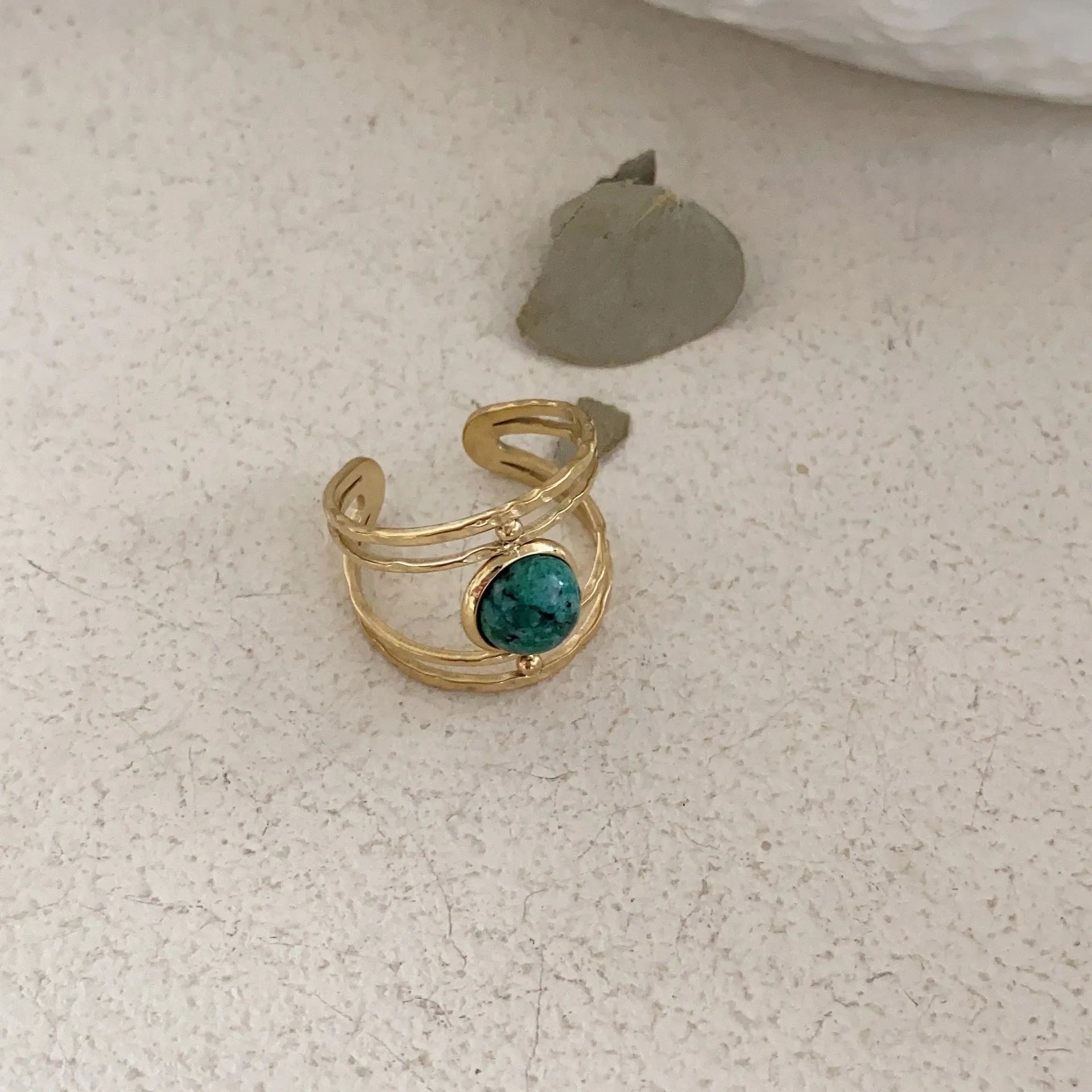 Geometric open ring with titanium steel electroplating and natural green stone elements