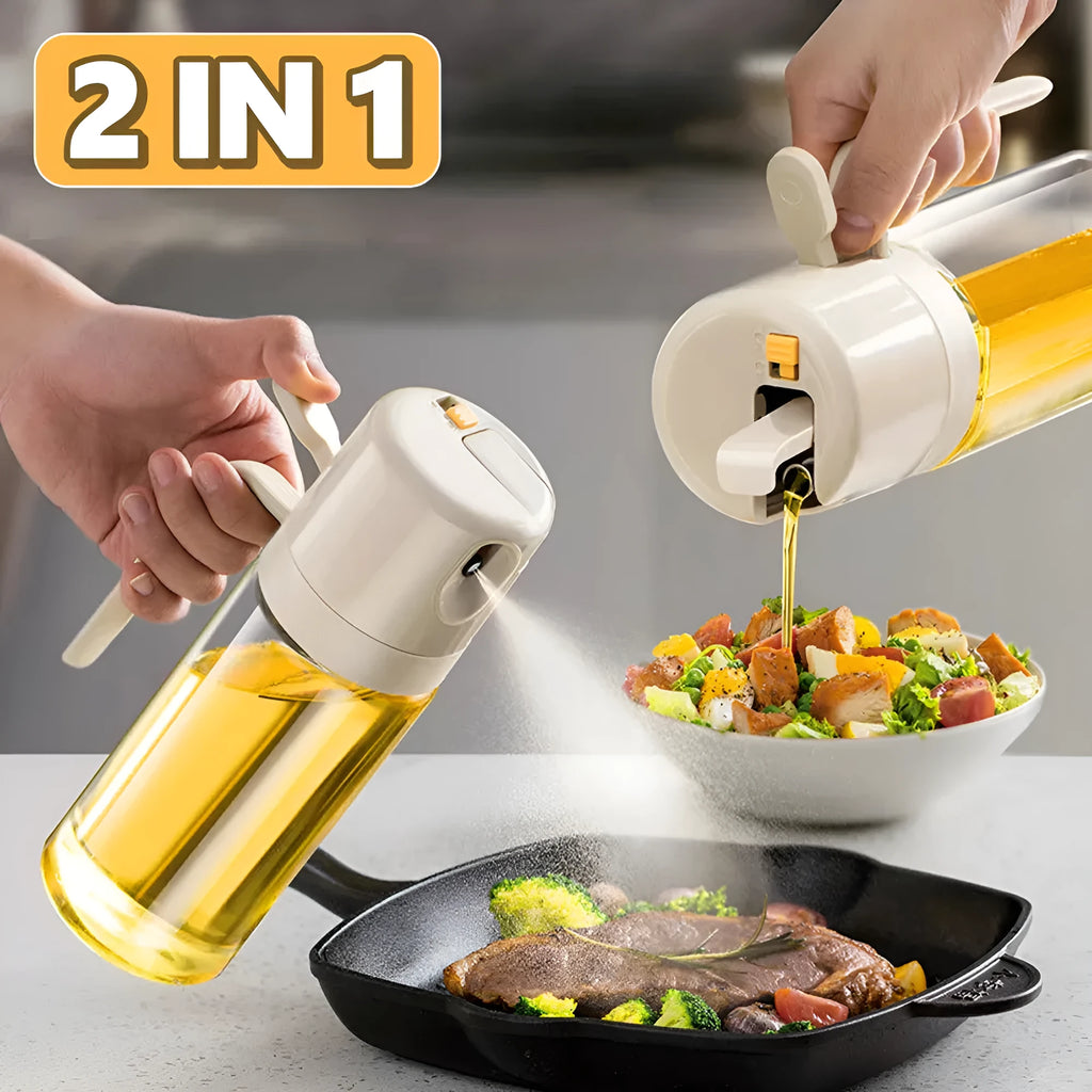 Warm grey glass oil sprayer bottle with a dual-mode cap switch, shown on a kitchen counter.
