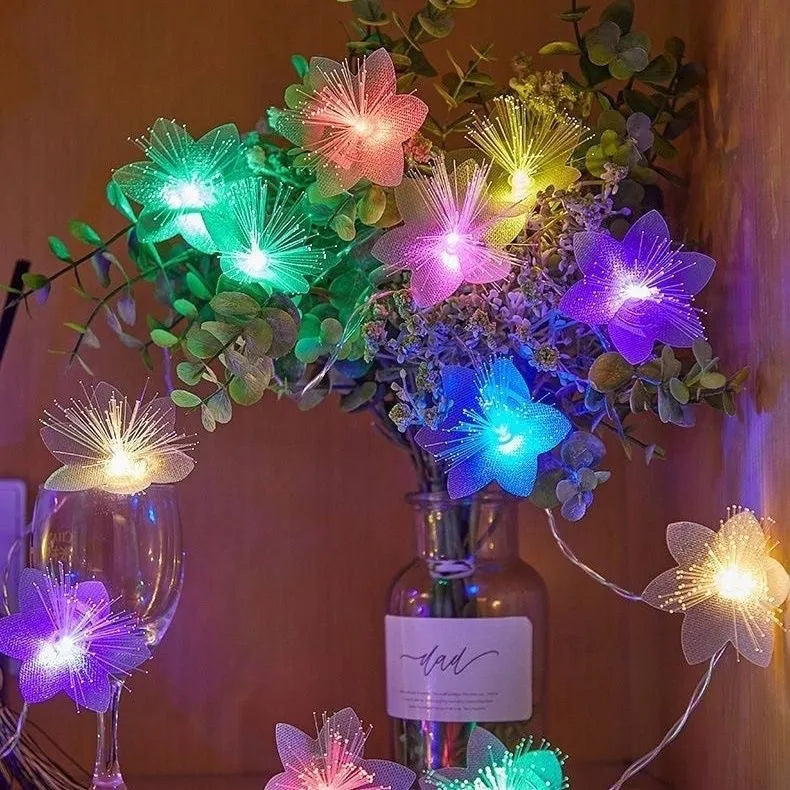 LED optical fibre flower light string with 20 warm white beads and battery box on a table decoration