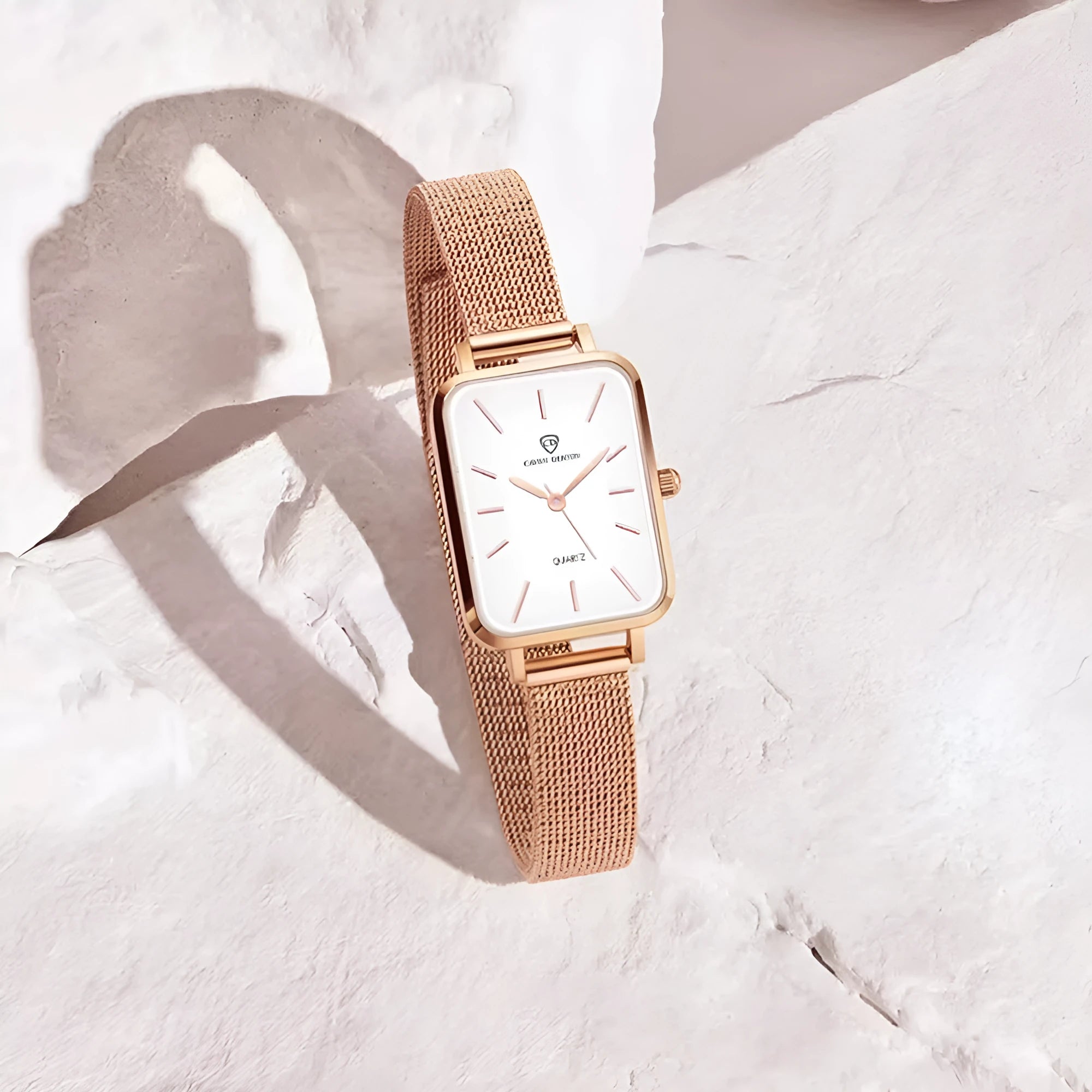 Women's rose gold waterproof quartz watch with alloy case and woven steel strap.