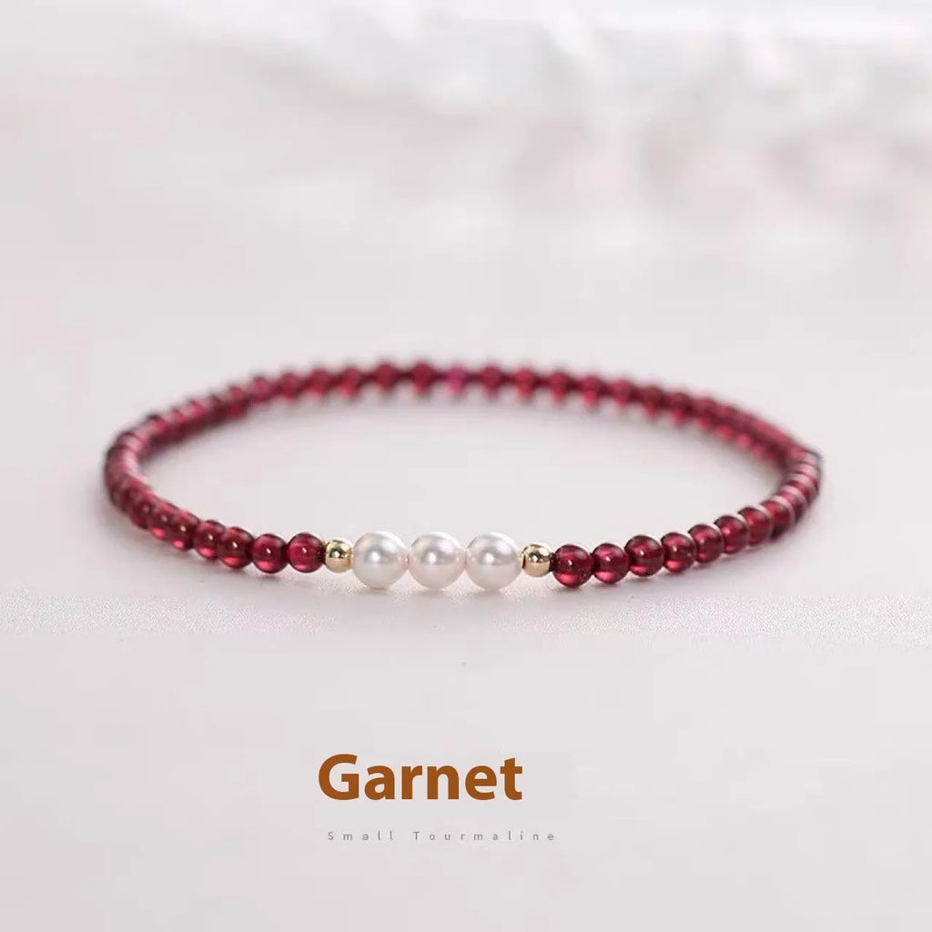 Women's garnet and artificial pearl bracelet with crystal details and adjustable clasp