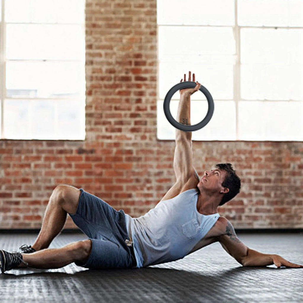 Black silicone coated iron exercise hoop 32cm diameter 4.5kg on indoor floor
