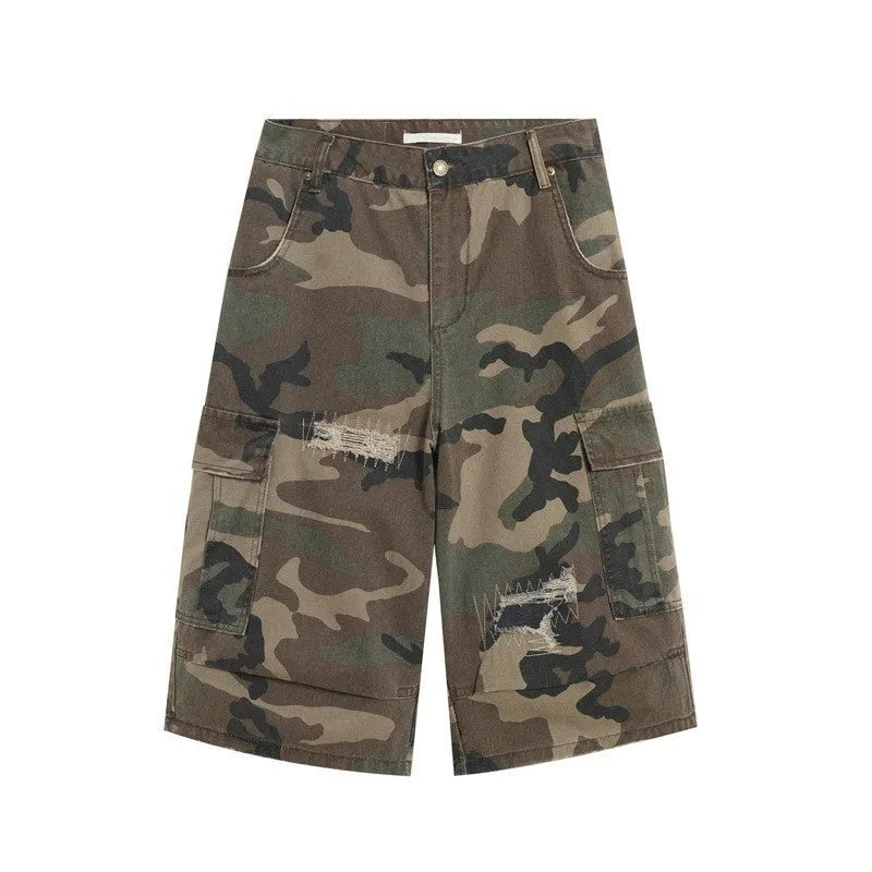 Men's loose straight-leg jeans in camouflage colour with cropped length and distressed patch detailing