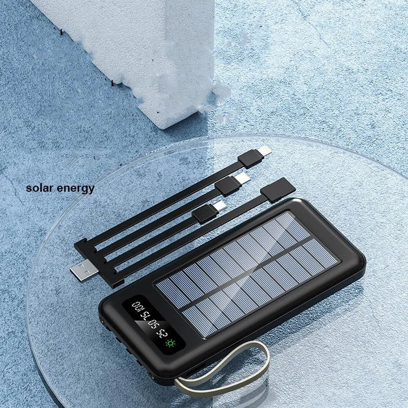 Black and white solar power bank showing size, solar panel, and USB ports for charging phones outdoors.