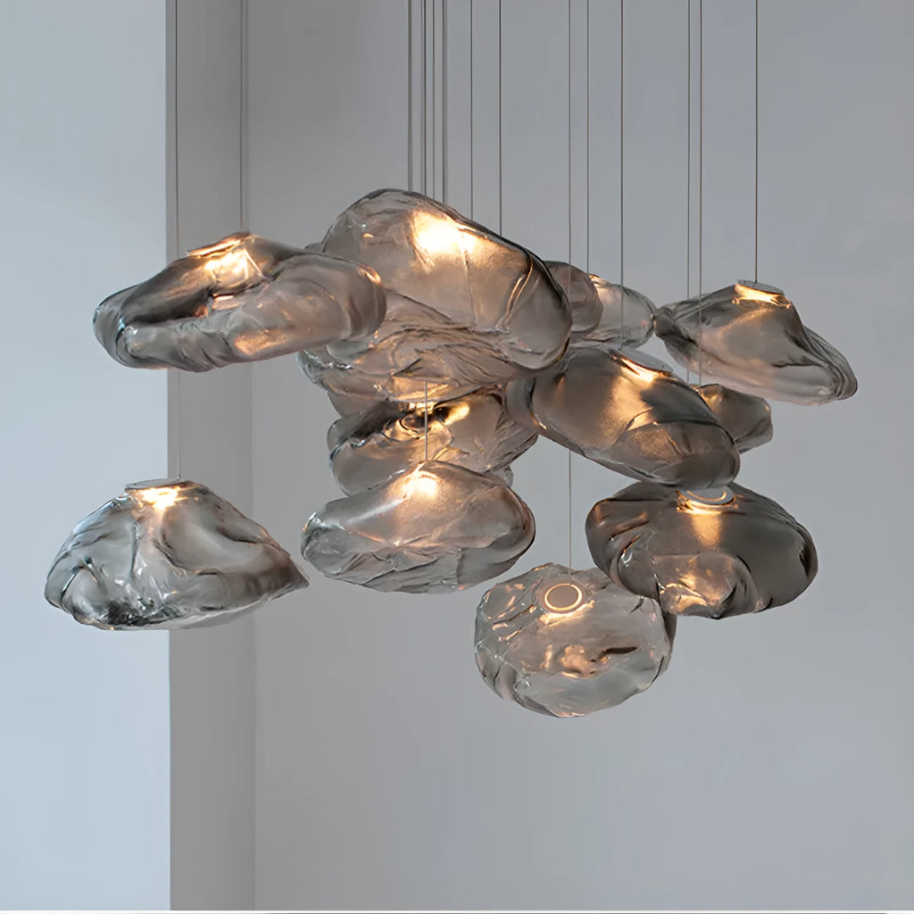 Modern light luxury glass chandelier in amber, clear, and smoke grey colours for lounge lighting.