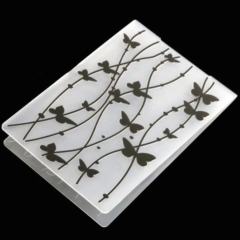 Plastic cake decorative mould showing windmill, flower, and star designs with dimensions 14.5 by 10.5 cm