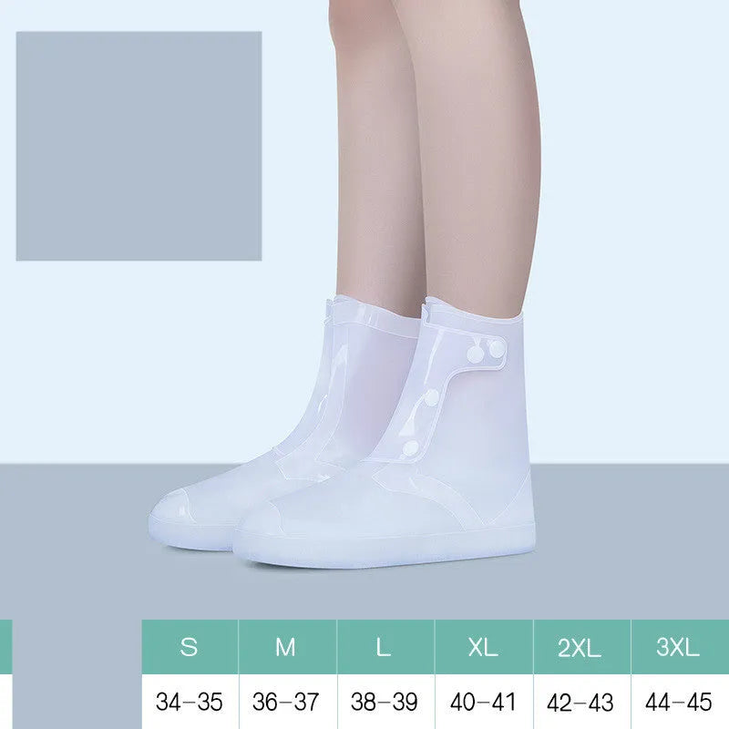 White high-top PVC reusable waterproof shoe covers for women on a wet surface.