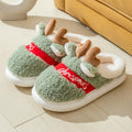 Christmas elk winter home slippers in pink with suede upper and thickened EVA sole on a cream background