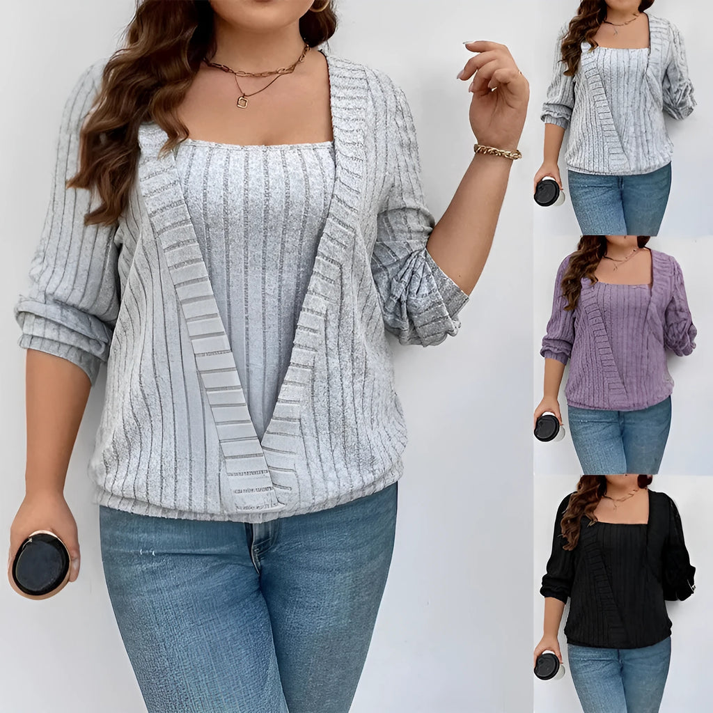 Solid colour ribbed knit V-neck false two-piece suit top with long sleeves on a hanger.
