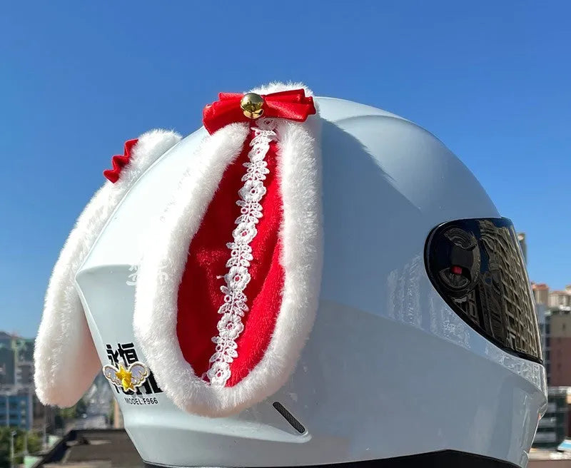 Black carbon fibre rabbit ears decoration attached to a motorcycle helmet