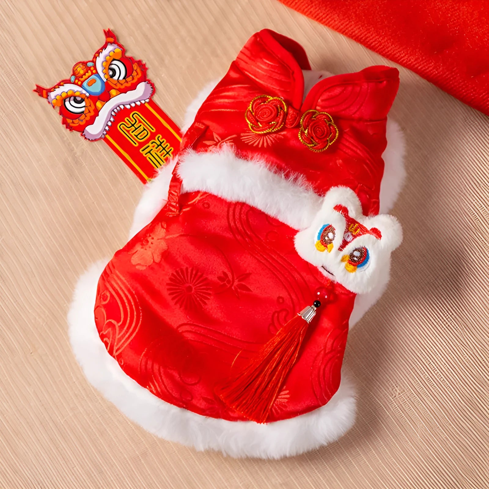 Red lion dance pet dog vest with 3D lion head ornament and golden buttons on white background