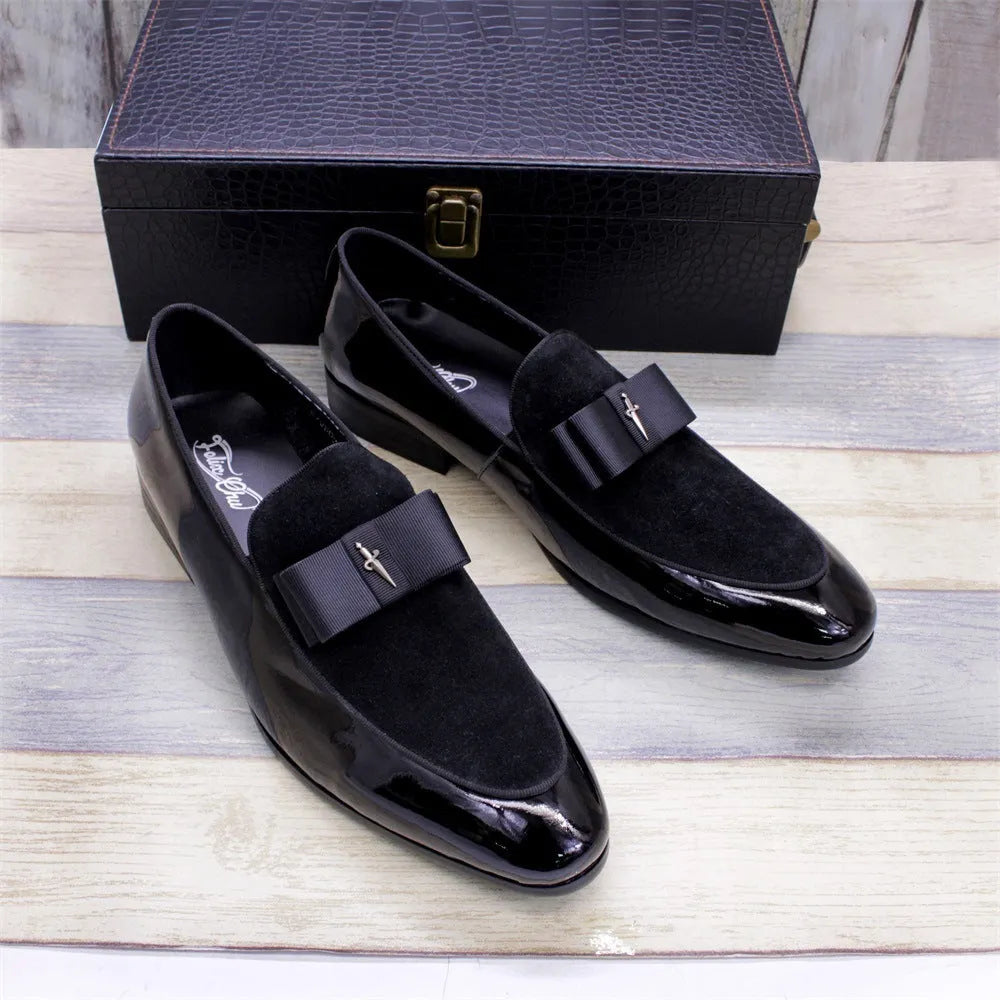 Men's glossy black patent leather low-top shoes with a tassel on a leather toe holder.