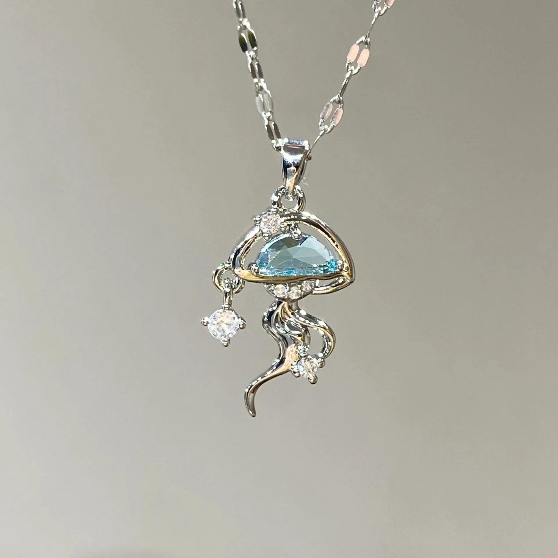 Sterling silver blue jellyfish necklace with white gold finish on adjustable chain