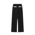 Women's beaded leather-look top and high-waisted trouser two-piece suit set in contrasting colours.