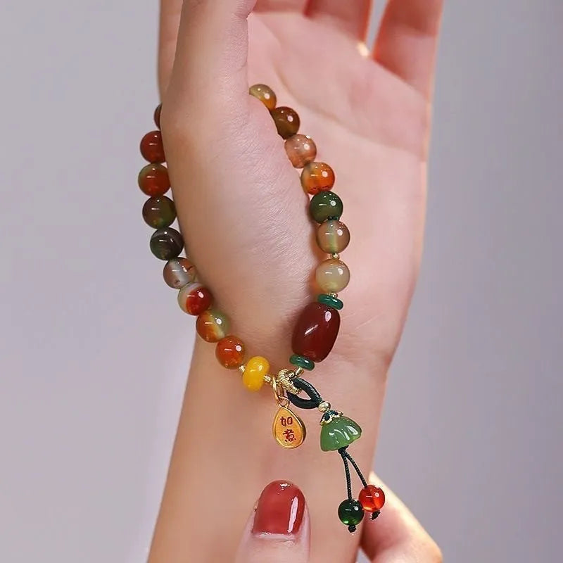Handcrafted lotus ruyi bracelet with mixed materials and traditional Chinese design