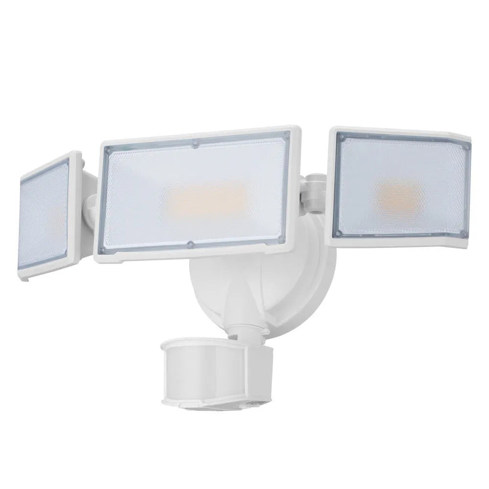White LED security flood light with motion sensor mounted on an exterior wall.