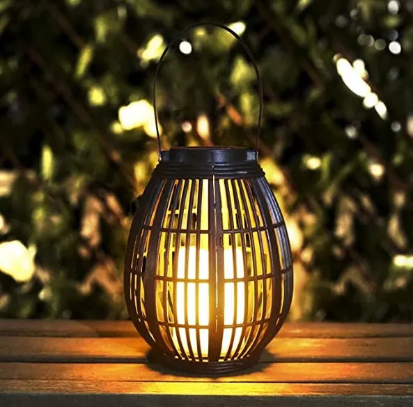 Oval solar garden light with rattan wind lamp design measuring 180x180x230mm