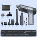 Wireless handheld car vacuum cleaner with brushes and nozzles on grey background