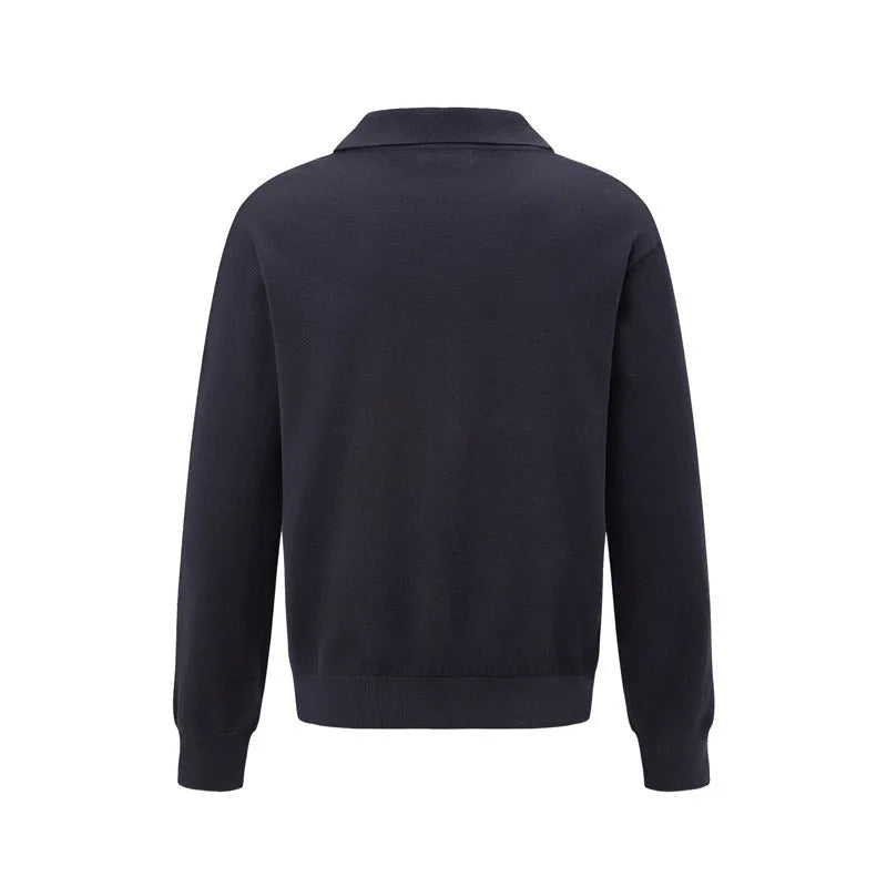Loose fit black pullover sweater on a hanger, casual wear