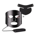 Black and white LED phototherapy face mask with controller on a strap for home skincare use.