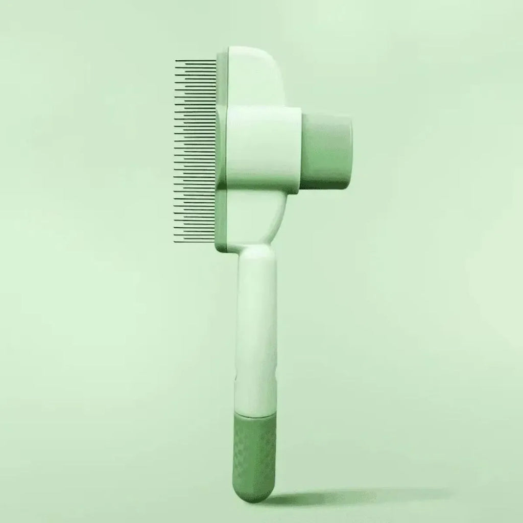 Green pet grooming brush with one-click hair removal system and soft rubber bristles for dogs