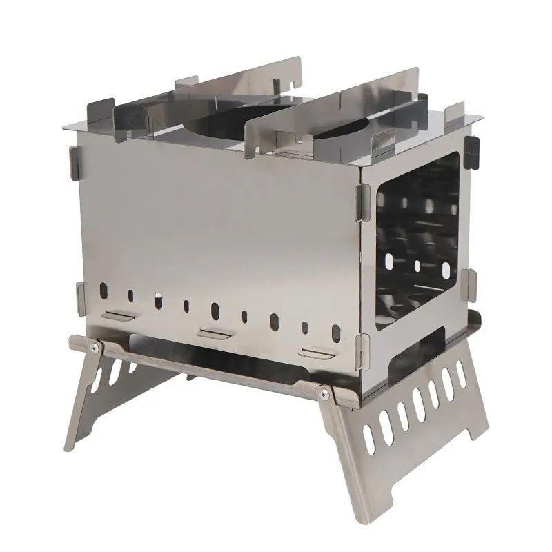 Silver outdoor folding card stove with grill mesh and storage bag on table