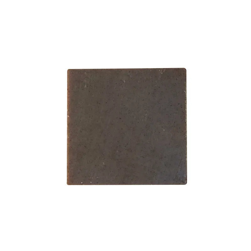 A 72-gram bar of nine grass cold process shampoo soap, silicone oil-free.