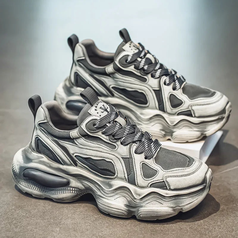 Men's black and white low-top mesh sneakers with a platform sole and lace-up front.