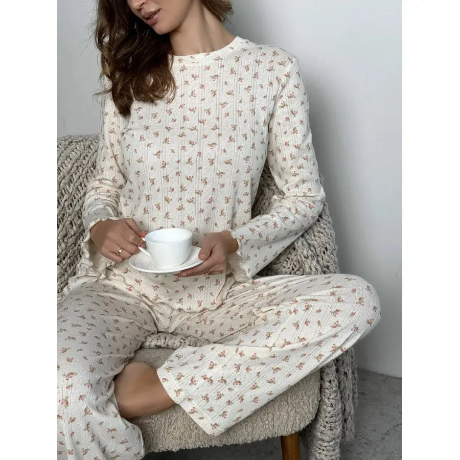 White floral print women's co-ord suit with bell sleeve top and wide leg trousers