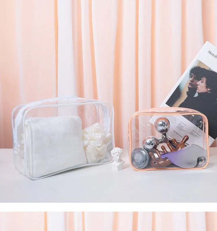 Semi-transparent PVC makeup bag in black, pink, or white colour, shown in L and XL sizes.