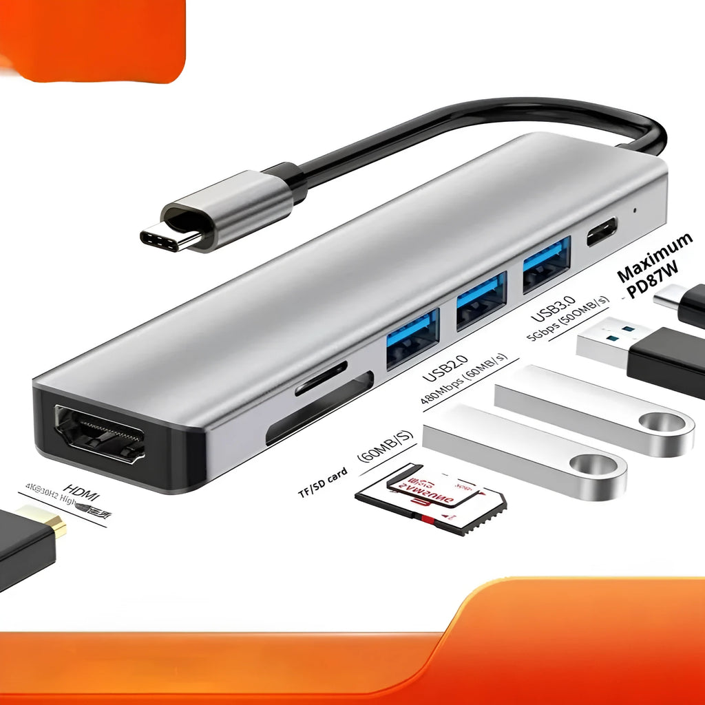 Silver USB Type-C 7-in-1 expansion dock with HDMI port and 15cm attached cable on a desk.