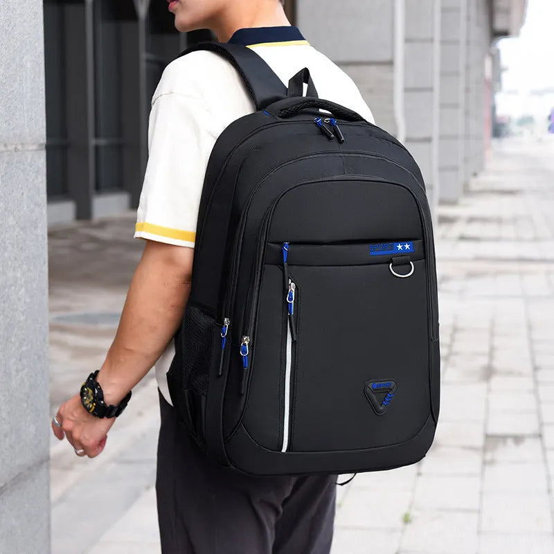 Men's Oxford cloth schoolbag in red with letter pattern, showing air pillow belt burden reduction system