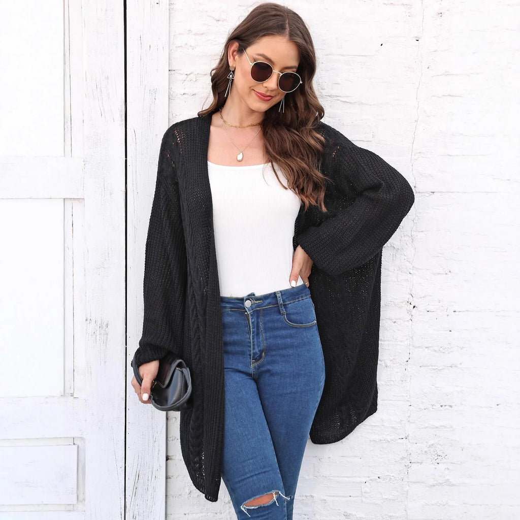 Women's loose longline acrylic cardigan sweater coat in a solid colour.